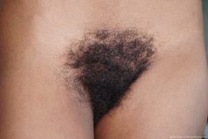Afro-American beauty Sofia Cuty shows her big boobs & bushy twat as she strips