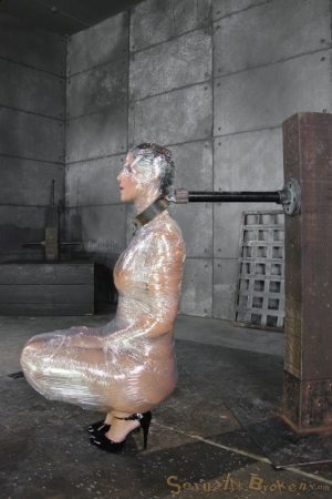 MILF Syren De Mer is wrapped up in saran wrap before being face fucked
