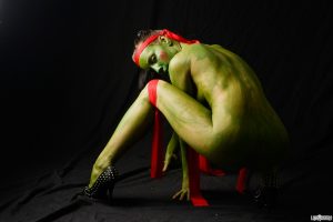 Hot cosplay chick Shana Lane stretches & squats nude revealing her green pussy
