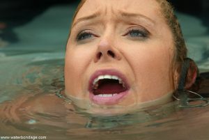 Submissive MILF Christina Carter gets choked and tortured in the jacuzzi
