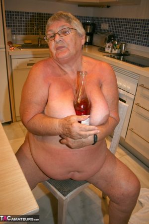 Mature BBW Grandma Libby strips in the kitchen to wine & dine & toy pussy nude