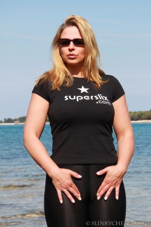 German MILF Desyra Noir reveals her big tits with pierced nipples on the beach