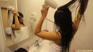 Asian hooker Soey fixes her hair after bareback sex with a foreigner