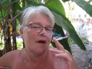 Old woman Girdle Goddess smokes before exposing her fat body on her patio