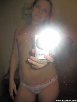 Innocent teen Kira posing topless in panties and taking selfies