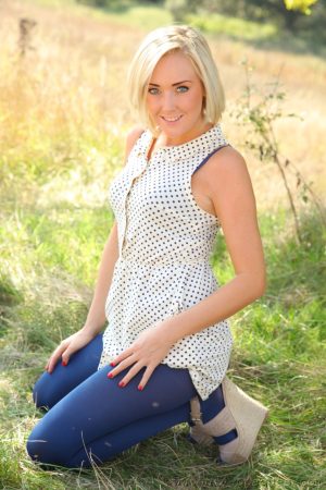 Adorable blonde Lucy Anne reveals her titties wearing blue nylons outdoors