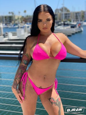 Curvaceous stunner Payton Preslee flaunting her huge melons in a pink bikini