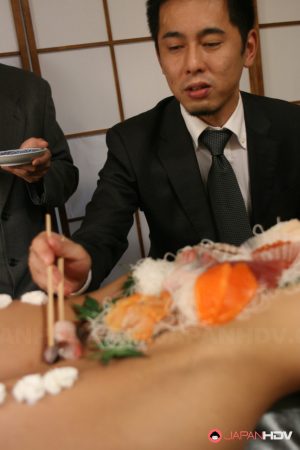 Sweet Asian babe Ramu Nagatsuki gets toyed while covered with sushi on a table