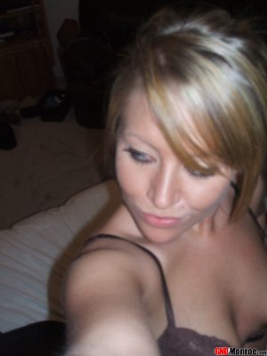 Blonde amateur takes self shots while wearing a brassiere and pyjama bottoms