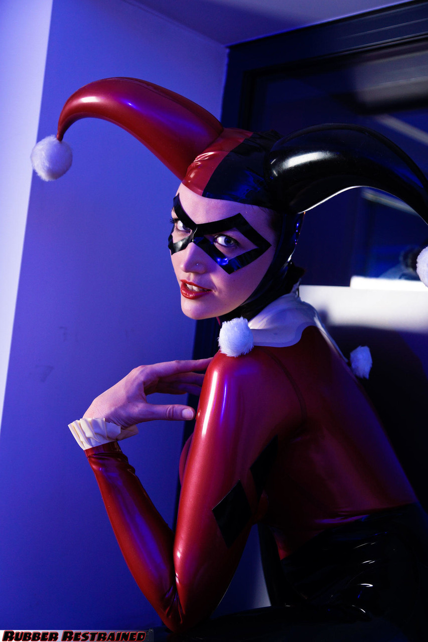 Solo model Dutch Dame poses in a Harley Quinn themed latex outfit