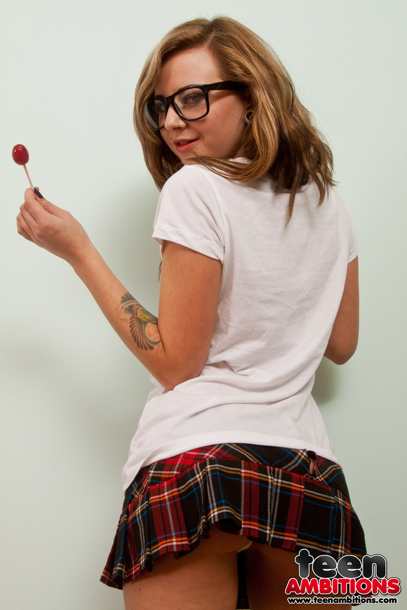 Nerdy teen Alexa Brooks strips to striped OTK socks and red heels on her bed